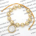Pulsera de Bolas Doradas con Medalla de San Benito